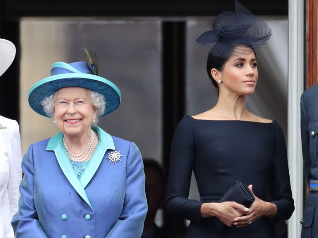 LONDON, ENGLAND - JULY 10: Queen Elizabeth II and Meghan, Duchess of Sussex on the balcony of Buckingham Palace as the Royal family attend events to mark the Centenary of the RAF on July 10, 2018 in London, England. (Photo by Chris Jackson/Getty Images)