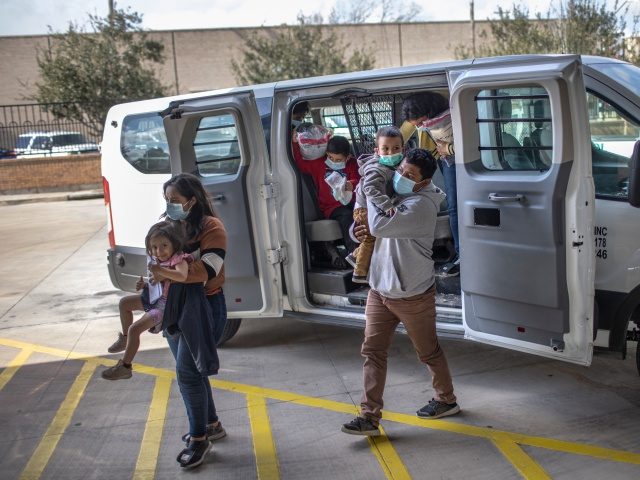 BROWNSVILLE, TEXAS - FEBRUARY 26: Asylum seekers are released by the U.S. Border Patrol at a bus station on February 26, 2021 in Brownsville, Texas. U.S. immigration authorities are now releasing many asylum seeking families after they cross the U.S.-Mexico border and are taken into custody. The immigrant families are …