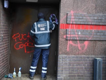 BRISTOL, ENGLAND - MARCH 22: (EDITORS NOTE: IMAGE CONTAINS PROFANITY) Workers clean up after the protest on March 22, 2021 in Bristol, England. Protests in Bristol on Saturday at the "Kill the Bill" demonstration turned violent as protestors clashed with police. Crowds had gathered for the demonstration in opposition to …