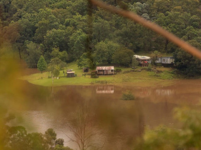 COLO, AUSTRALIA - MARCH 23: Properties are seen surrounded by floodwaters from the Colo river on March 23, 2021 in Colo, Australia. Evacuation warnings are in place for parts of Western Sydney as floodwaters continue to rise. (Photo by Jenny Evans/Getty Images)