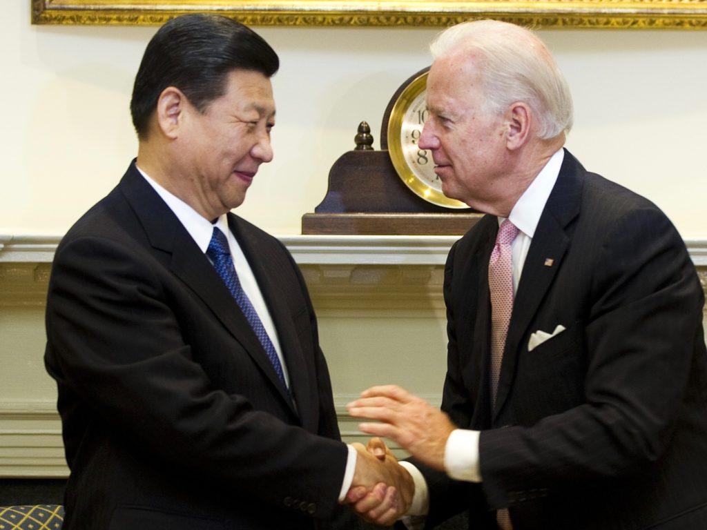 US Vice President Joe Biden (R) shakes hands with Chinese Vice President Xi Jinping in the Roosevelt Room at the White House in Washington, DC, February 14, 2012. Xi, who arrived in Washington on Monday, is expected to succeed President Hu Jintao in 2013. Chinese presidents generally serve two five-year terms, meaning Xi could be in charge when some experts forecast that China will surpass the United States as the world's largest economy. AFP PHOTO/Jim WATSON (Photo credit should read JIM WATSON/AFP via Getty Images)