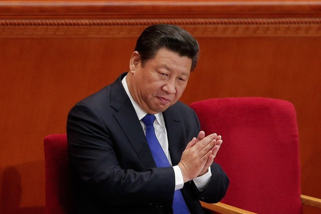 BEIJING, CHINA - MARCH 05: Chinese President Xi Jinping applauds during the opening of the