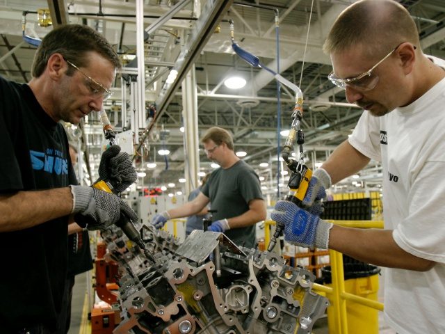 CLEVELAND, OH - MAY 11: Employees assemble Duratec V-6 engines at Ford Motor Company's Engine Plant No. 1 May 11, 2004 in Cleveland, Ohio. Idle for nearly three years, the plant will now produce engines utilized in the all-new 2005 Ford Five Hundred and Mercury Montego sedans as well as …