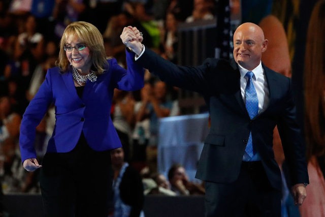 PHILADELPHIA, PA - JULY 27: Former Congresswoman Gabby Giffords walks on stage with her husband, retired NASA Astronaut and Navy Captain Mark Kelly, after delivering remarks on the third day of the Democratic National Convention at the Wells Fargo Center, July 27, 2016 in Philadelphia, Pennsylvania. Democratic presidential candidate Hillary …