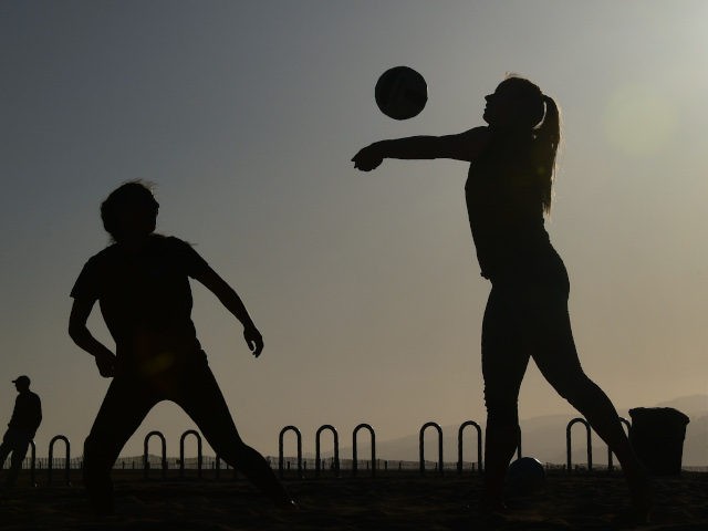 Santa Monica High School students play beach volleyball at Santa Monica beach near where the International Olympic Committee Evaluation Commission and LA 2024 gave press conferences as the IOC wrap up their visit to Los Angeles, California on May 11, 2017. / AFP PHOTO / FREDERIC J. BROWN (Photo credit …