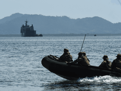 A team of special warfare troops of the Philippine Navy patrol the coastline with the Phil