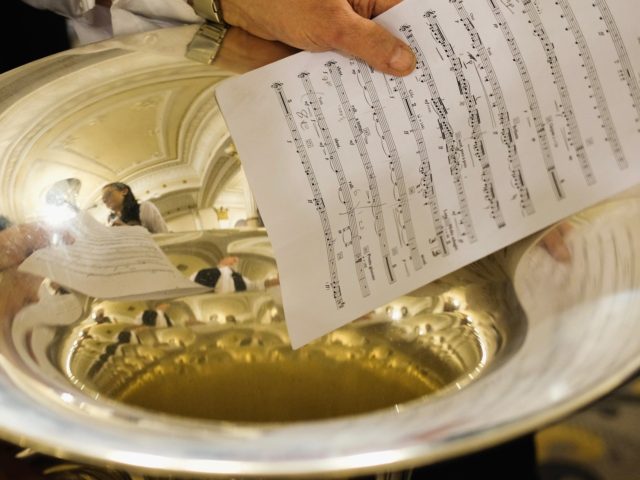 HUDDERSFIELD, ENGLAND - MARCH 04: A musician holds their sheet music as they wait to perform at Huddersfield Town Hall during the Yorkshire regional finals of the National Brass Band Championships of Great Britain on March 4, 2018 in Huddersfield, England. Over fifty brass bands competed at the event at …