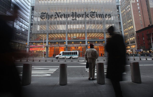 NEW YORK - DECEMBER 07: The New York Times' masthead is displayed in front of the midtown