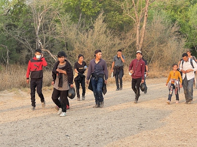A group of migrant families search for a Border Patrol agent after crossing the Rio Grande near Mission, Texas. (Photo: Randy Clark/Breitbart Texas)