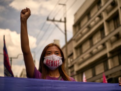 MANILA, PHILIPPINES - MARCH 08: Filipino activists march on the streets of Manila leading to the Malacanang in the nations capital to mark International Womens Day, on March 8, 2021 in Manila, Philippines. The protesters expressed their views, denouncing president Duterte's misogyny and lack of respect for women, who are …