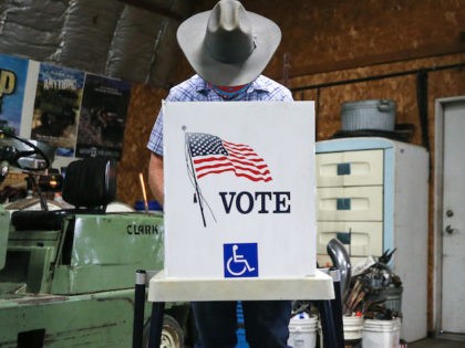 A voter marks his ballot at a polling place in Dennis Wilkening's shed on November 3, 2020 in Richland, Iowa. (Mario Tama/Getty Images)