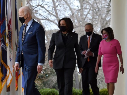 (from L) US President Joe Biden, US Vice President Kamala Harris, US Senate Majority Leader Chuck Schumer, Democrat of New York, and House Speaker Nancy Pelosi, Democrat of California, arrive for an event on the American Rescue Plan in the Rose Garden of the White House in Washington, DC, on …