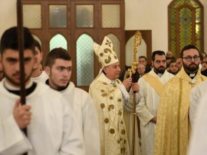 Joseph Tobji (C) Archeparch of the Maronite Catholic Archeparchy of Aleppo, blesses worshi