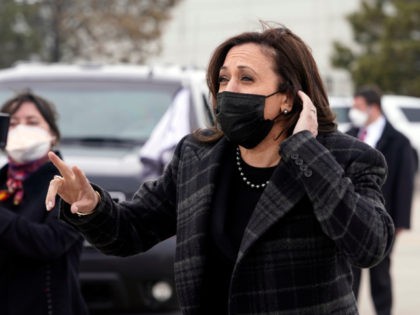 Vice President Kamala Harris listens to a question from the press before she boards Air Fo