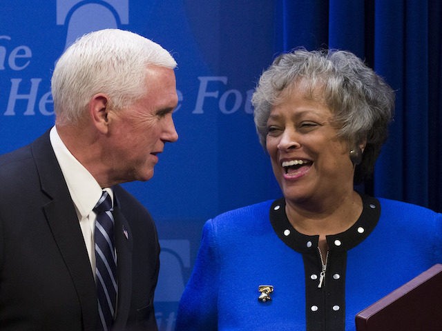 Vice President Mike Pence greets Heritage Foundation President Kay Coles James before spea