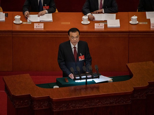 BEIJING, CHINA - MARCH 05: Chinese Premier Li Keqiang speaks at the opening session of the National People's Congress at the Great Hall of the People on March 5, 2021 in Beijing, China. The annual political gatherings of the National Peoples Congress and the Chinese People's Political Consultative Conference, known …