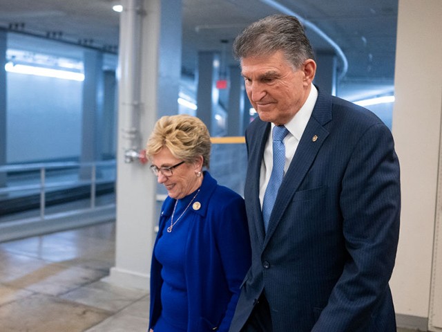 WASHINGTON, DC - FEBRUARY 4: Sen. Joe Manchin (D-WV) walks with his wife Gayle Conelly Manchin in the in the Senate subway at the U.S. Capitol on February 4, 2020 in Washington, DC. The Senate heard closing arguments yesterday after the Senate voted to block witnesses from appearing in the impeachment trial. The final vote is expected on Wednesday. (Photo by Alex Edelman/Getty Images)