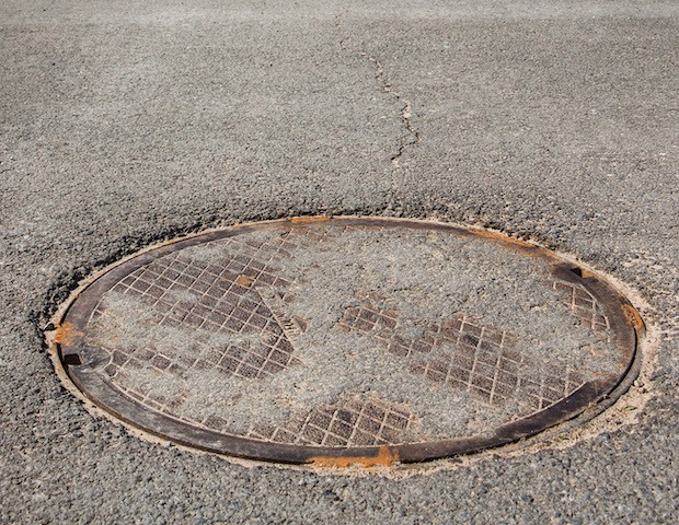 This file photo is a manhole in New York in 2015. (Andrew Burton/Getty Images)