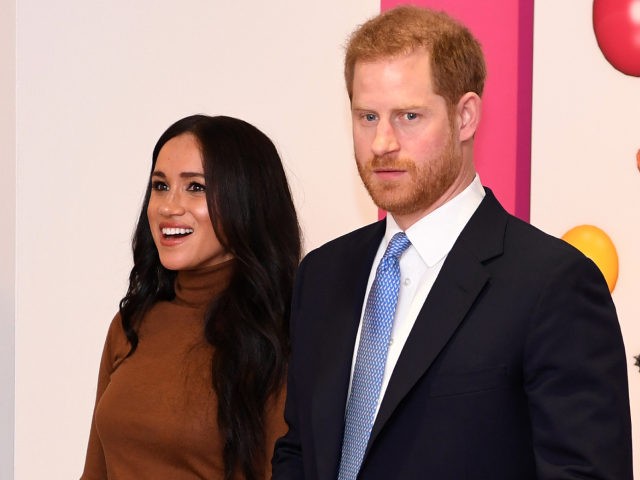Britain's Prince Harry, Duke of Sussex and Meghan, Duchess of Sussex react as they view a special exhibition of art by Indigenous Canadian artist, Skawennati, in the Canada Gallery during their visit to Canada House, in London on January 7, 2020, to give thanks for the warm Canadian hospitality and …