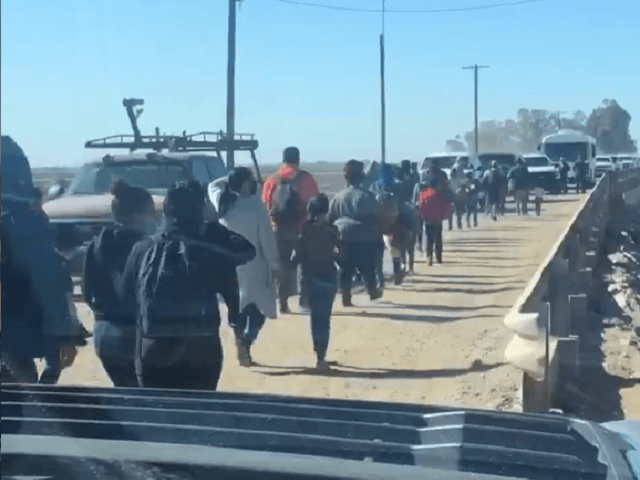 Migrants cross border from Mexico into Yuma in March. (Twitter Video Screenshot/Senator Ro