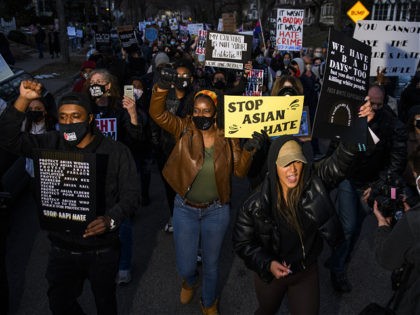 MINNEAPOLIS, MN - MARCH 18: People march through a neighborhood to protest against anti-Asian violence on March 18, 2021 in Minneapolis, Minnesota. Demonstrations have taken place across the country after a series of shootings on Tuesday by a white man near Atlanta, GA which left eight people dead, including six …