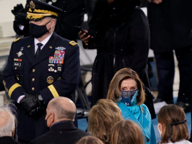 House Speaker Nancy Pelosi of Calif., arrives for the the 59th Presidential Inauguration at the U.S. Capitol in Washington, Wednesday, Jan. 20, 2021. At left is Joint Chiefs Chairman Gen. Mark Milley and right is former President Barack Obama. (AP Photo/Carolyn Kaster)