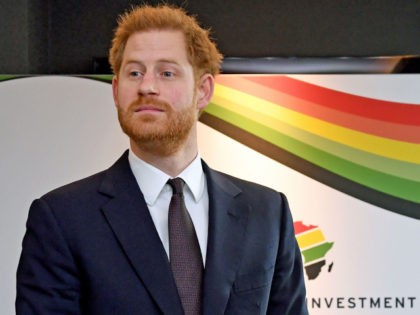 Britain's Prince Harry, Duke of Sussex reacts as he waits to meet a guest during the UK-Af