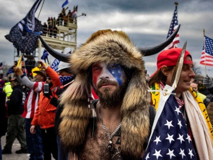 WASHINGTON, DC - JANUARY 6: Jacob Anthony Angeli Chansley, known as the QAnon Shaman, is seen at the Capital riots. On January 9, Chansley was arrested on federal charges of "knowingly entering or remaining in any restricted building or grounds without lawful authority, and with violent entry and disorderly conduct …