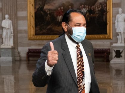 Rep. Al Green, D-Texas, gives thumbs up as he walks through the Rotunda to the Senate for the second impeachment trial of former President Donald Trump, Tuesday, Feb. 9, 2021, in Washington. (AP Photo/Alex Brandon)