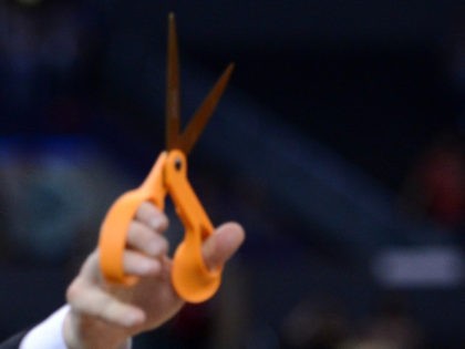 In this file photo, Head coach Gregg Marshall of the Wichita State Shockers holds up a pair of scissors before cutting down the net after defeating the Ohio State Buckeyes 70-66 during the West Regional Final of the 2013 NCAA Men's Basketball Tournament at Staples Center on March 30, 2013 …
