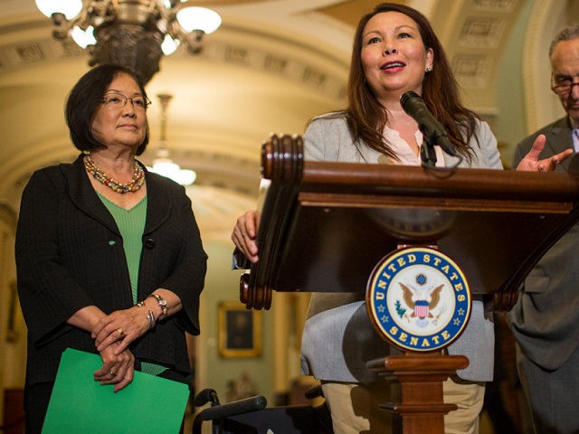 WASHINGTON, DC - AUGUST 21: Sen. Tammy Duckworth (D-IL) speaks during a weekly news conference on Capitol Hill on August 21, 2018 in Washington, DC. Also pictured are Sen. Mazie Hirono (D-HI) and Senate Minority Leader Chuck Schumer (D-NY). (Photo by Zach Gibson/Getty Images)