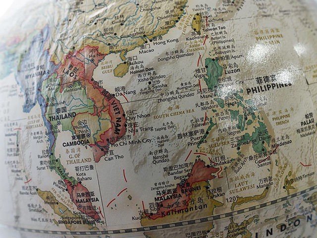 The South China Sea (C) is seen on a globe for sale at a bookstore in Beijing on June 15,