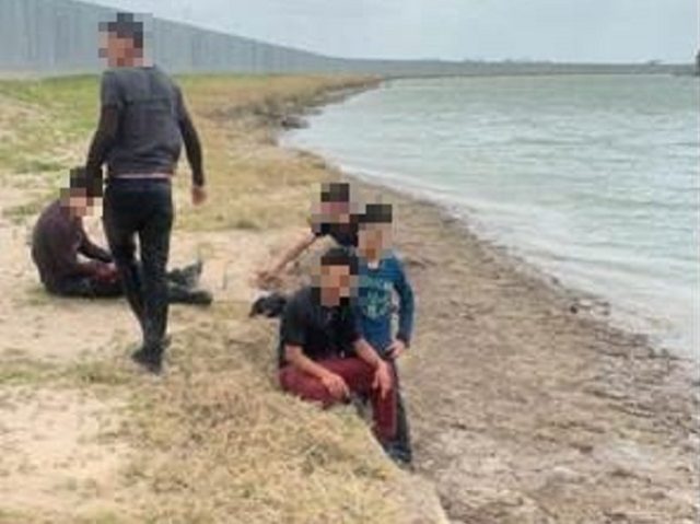 Five migrants escape death after smuggler drives loaded truck into Rio Grande. (Photo: U.S