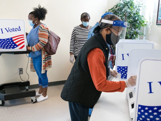 People cast votes at the Richland County Voter Registration & Elections Office on the second day of in-person absentee and early voting on October 6, 2020 in Columbia, South Carolina. (Sean Rayford/Getty Images)