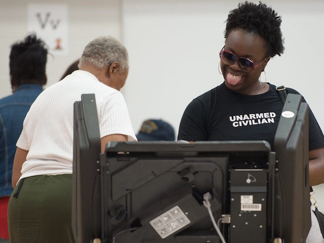 A woman casts her vote during Missouri primary voting at Jury Elementary School on March 1