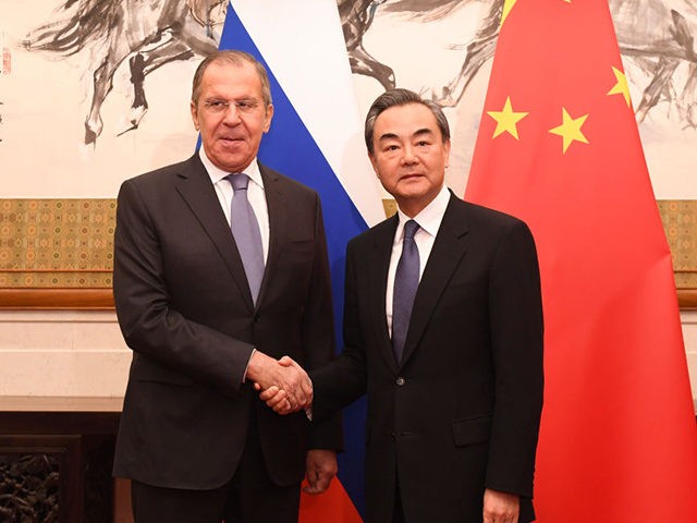 BEIJING, CHINA - APRIL 22: Russia's Foreign Minister Sergei Lavrov (left) shakes hands wit