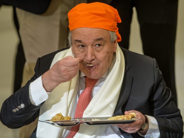 United Nations Secretary-General Antonio Guterres eats food at the Langar Khana during his