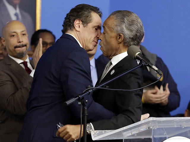In this file photo, New York Gov. Andrew Cuomo, left, Rev. Al Sharpton embrace as Cuomo is introduced at the National Action Network House of Justice, in New York, Monday, Jan. 15, 2018. (Richard Drew/AP Photo)
