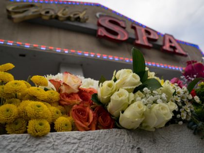 ATLANTA, GA - MARCH 18: Flowers adorn Gold Spa during a demonstration against violence towards women and Asians following Tuesday night's shooting in which three women were gunned down on March 18, 2021 in Atlanta, Georgia. Suspect Robert Aaron Long, 21, was arrested after a series of shootings at three …