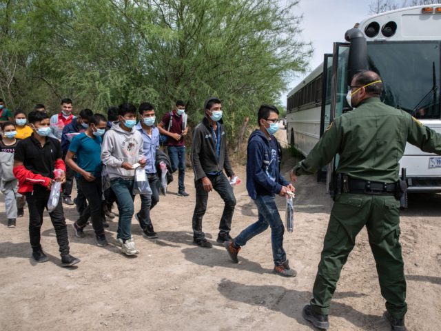 HIDALGO, TEXAS - MARCH 25: Unaccompanied minors prepare to board a U.S. Border Patrol tran