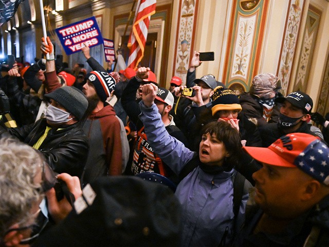 Supporters of US President Donald Trump protest inside the US Capitol on January 6, 2021, in Washington, DC. - Demonstrators breeched security and entered the Capitol as Congress debated the a 2020 presidential election Electoral Vote Certification. (Photo by ROBERTO SCHMIDT / AFP) (Photo by ROBERTO SCHMIDT/AFP via Getty Images)