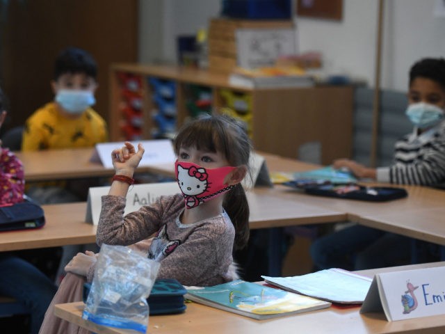 Second-grade pupils wear face masks as they attend school lessons at the Petri primary school in Dortmund, western Germany, on February 22, 2021, amid the novel coronavirus COVID-19 pandemic. - Schools and daycare centres partially reopened in 10 German regions. The impact of school reopenings would be closely watched before …