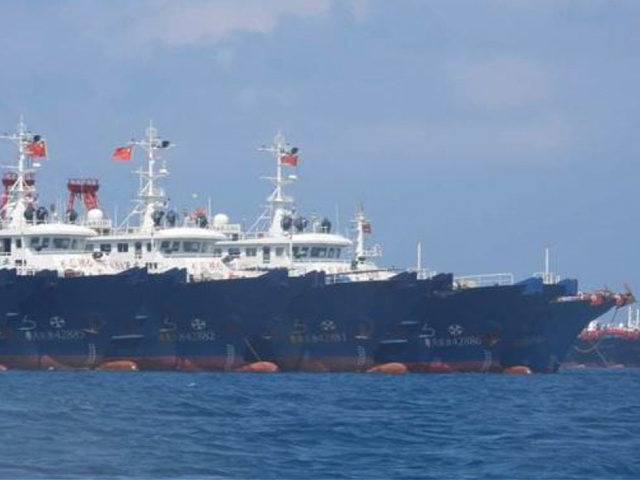 In this March 7, 2021, photo provided by the Philippine Coast Guard/National Task Force-West Philippine Sea, some of the 220 Chinese vessels are seen moored at Whitsun Reef, South China Sea. The Philippine government expressed concern after spotting more than 200 Chinese fishing vessels it believed were crewed by militias …