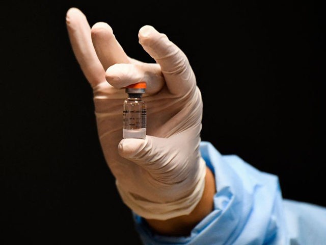A nurse holds a vial of the CoronaVac vaccine -developed by China's Sinovac laboratory- against the COVID-19 disease, in Bogota on March 9, 2021. (Photo by Juan BARRETO / AFP) (Photo by JUAN BARRETO/AFP via Getty Images)
