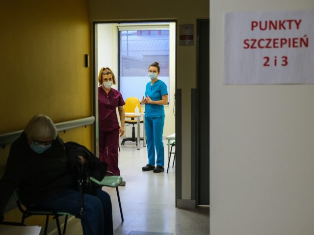 KRAKOW, POLAND - JANUARY 25: Health workers wear protective face masks and gloves as they