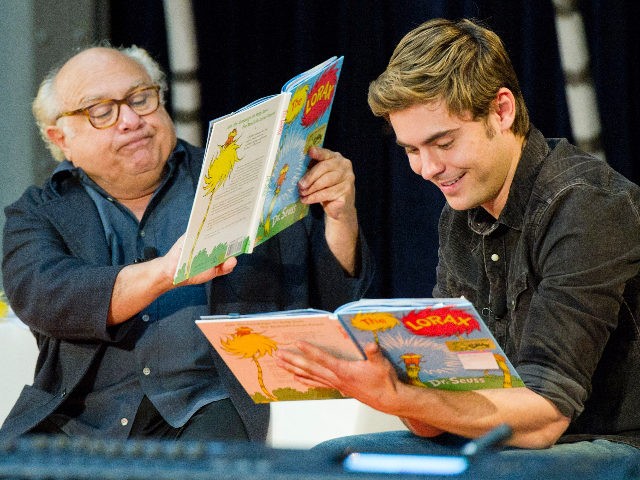 Dr. Seuss' "The Lorax" stars Danny DeVito, left, and Zac Efron read to school children at the National Education Association's 15th annual Read Across America Day at The New York Public Libary, in New York, Friday, March 2, 2012. (AP Photo/Charles Sykes)