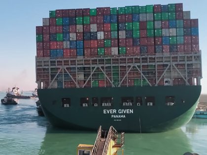 This picture taken on March 29, 2021 from a nearby tugboat in the Suez Canal shows a view of the Panama-flagged MV 'Ever Given' (operated by Taiwan-based Evergreen Marine) container ship as it begins to move. - Egypt's Suez Canal Authority said on March 29 the Ever Given container ship, …