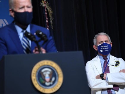 TOPSHOT - US President Joe Biden speaks, flanked by White House Chief Medical Adviser on C