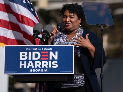 Former US Representative and voting rights activist Stacey Abrams speaks at a Get Out the Vote rally with former US President Barack Obama as he campaigns for Democratic presidential candidate former Vice President Joe Biden on November 2, 2020, in Atlanta, Georgia. (Photo by Elijah Nouvelage / AFP) (Photo by …