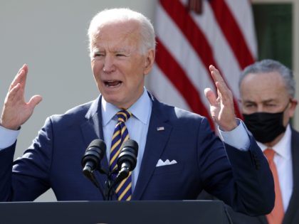 WASHINGTON, DC - MARCH 12: U.S. President Joe Biden (L) speaks as U.S. Senate Majority Leader Sen. Chuck Schumer (D-NY) listens during an event on the American Rescue Plan in the Rose Garden of the White House on March 12, 2021 in Washington, DC. President Biden signed the $1.9 trillion …